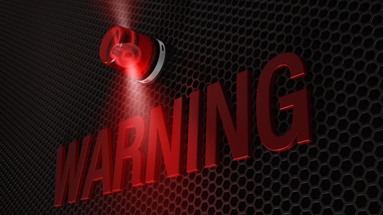 Rote Warnlampe und Schriftzug "Warning"